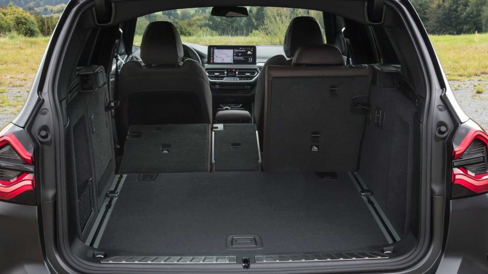 Shot inside the trunk of a 2022 BMW X3 with the rear seats folded.
