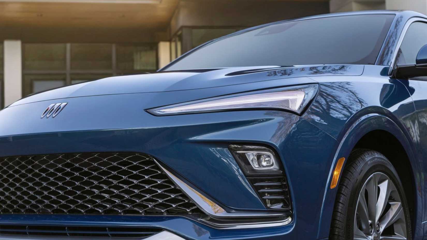 Close-up shot of the front end of a dark blue 2024 Buick Envista.