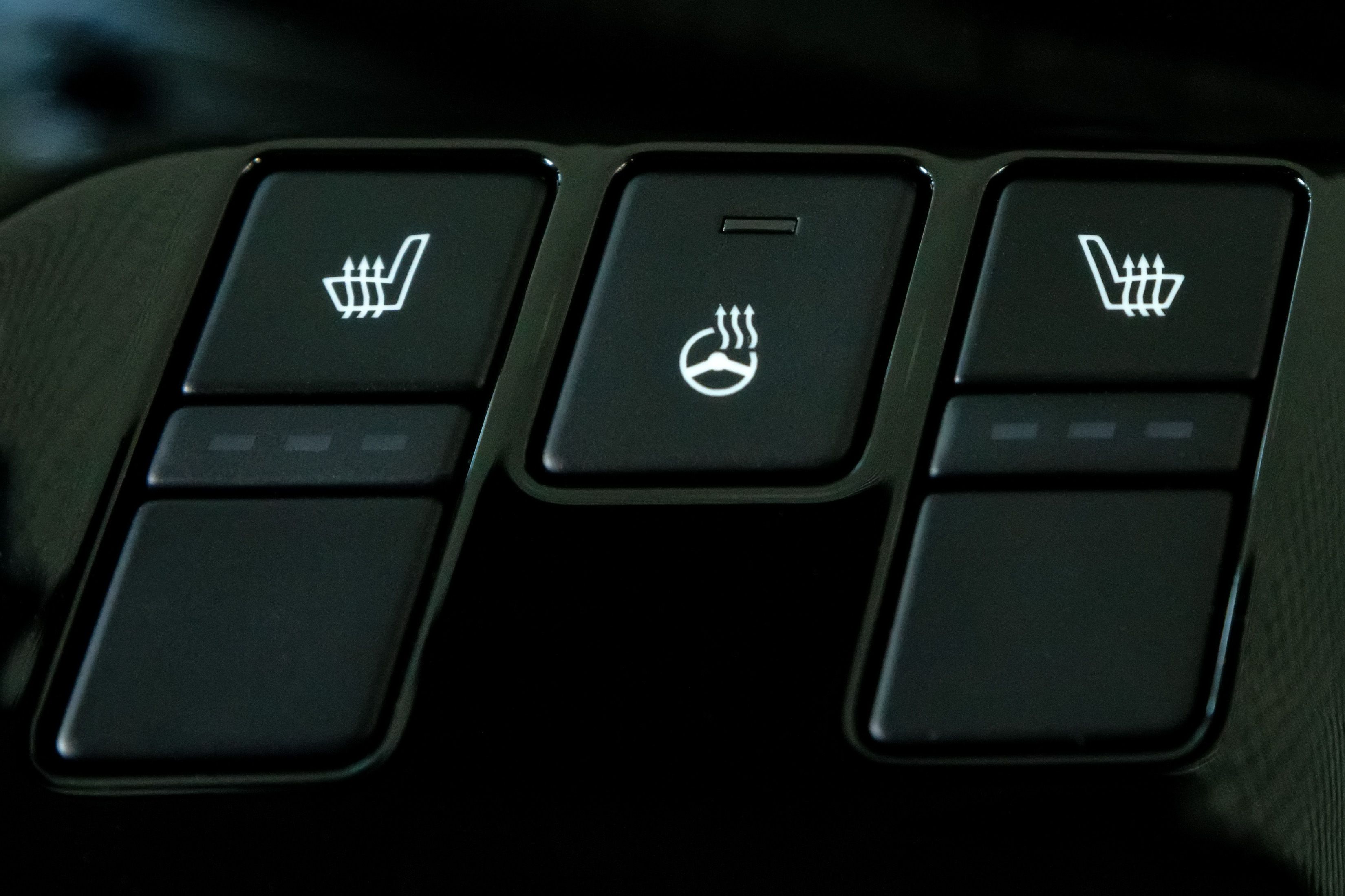 Close up of heated seats and steering wheel button