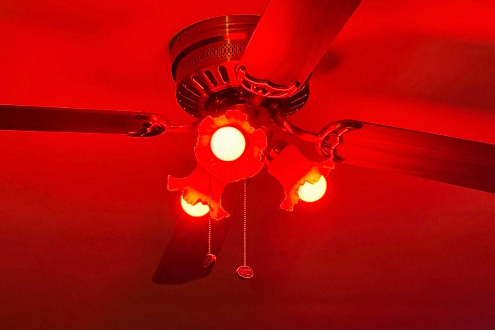Smart bulbs turned red on the ceiling.