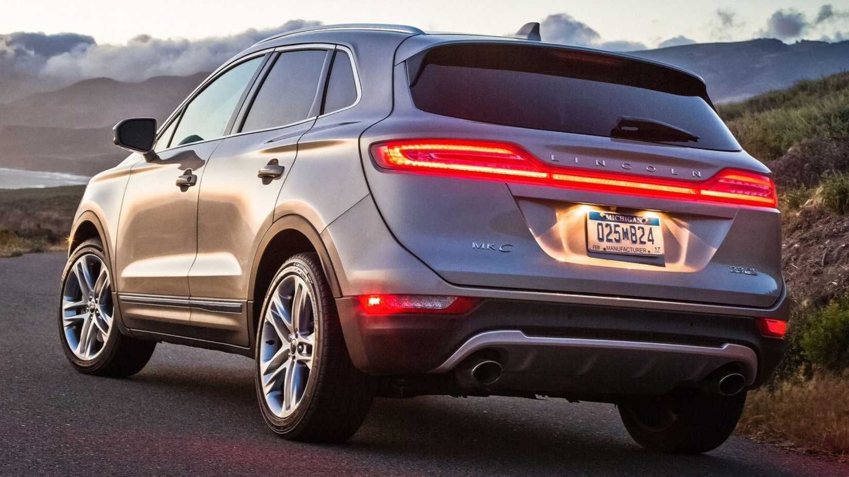 Static rear 3/4 shot of a silver 2015 Lincoln MKC.