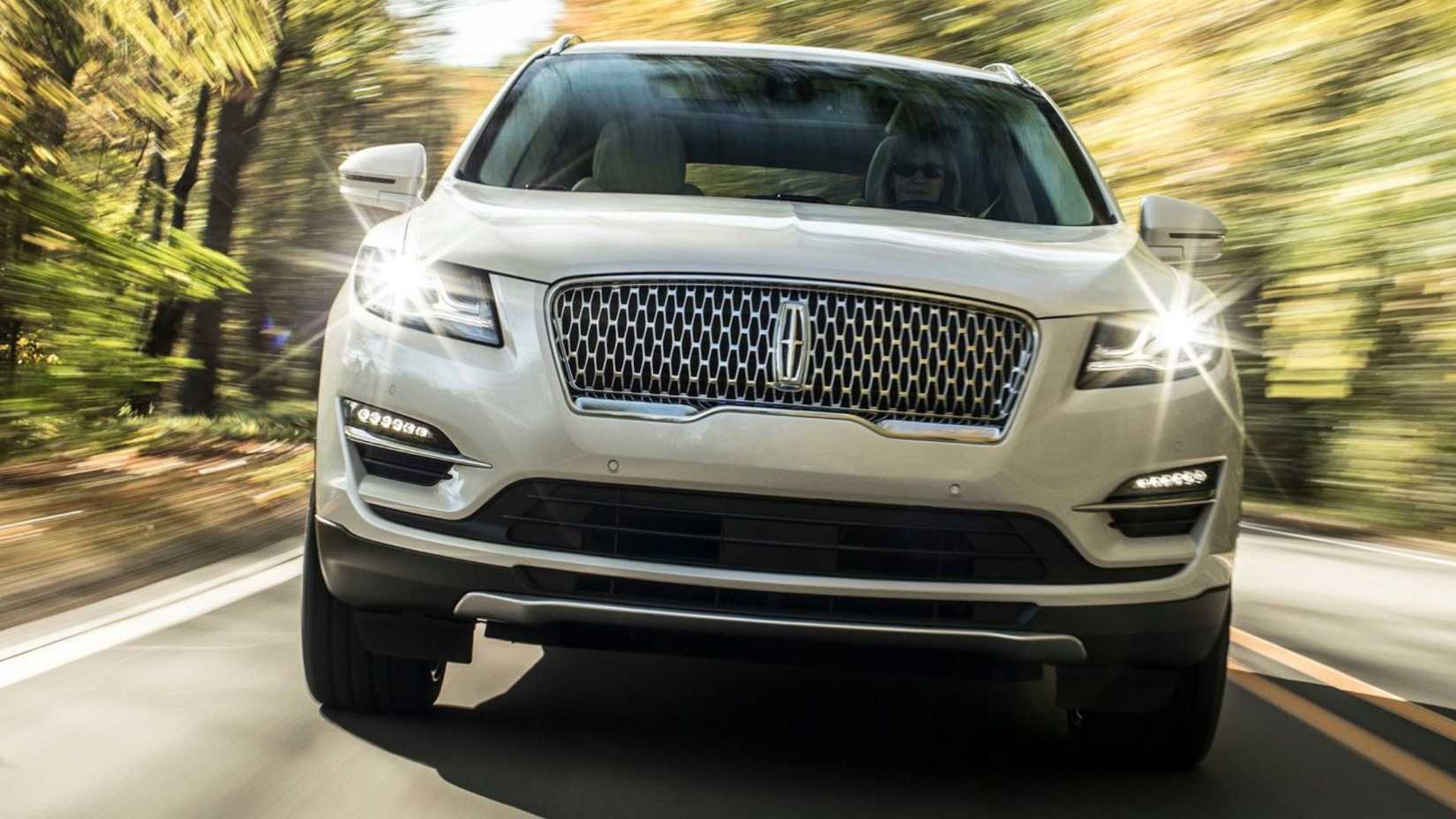 Dynamic front-end shot of a white 2019 Lincoln MKC.