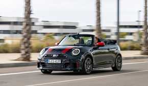 Front 3/4 action shot of a 2025 Mini Cooper JCW Convertible