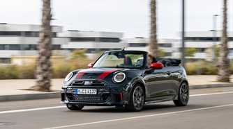 Front 3/4 action shot of a 2025 Mini Cooper JCW Convertible