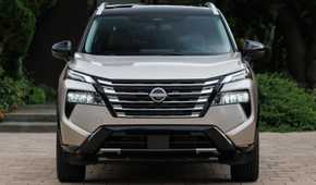 Static front-end shot of a gold 2024 Nissan Rogue.