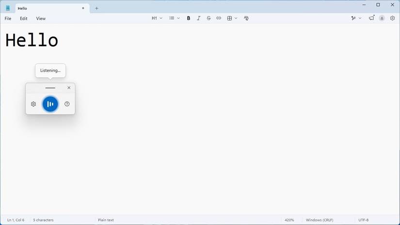 Notepad with Windows Voice Typing popup visible. 