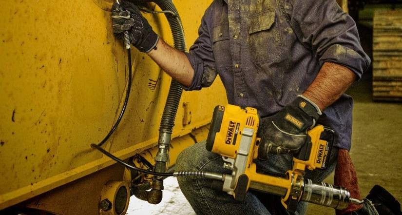 Person using the DeWALT grease gun