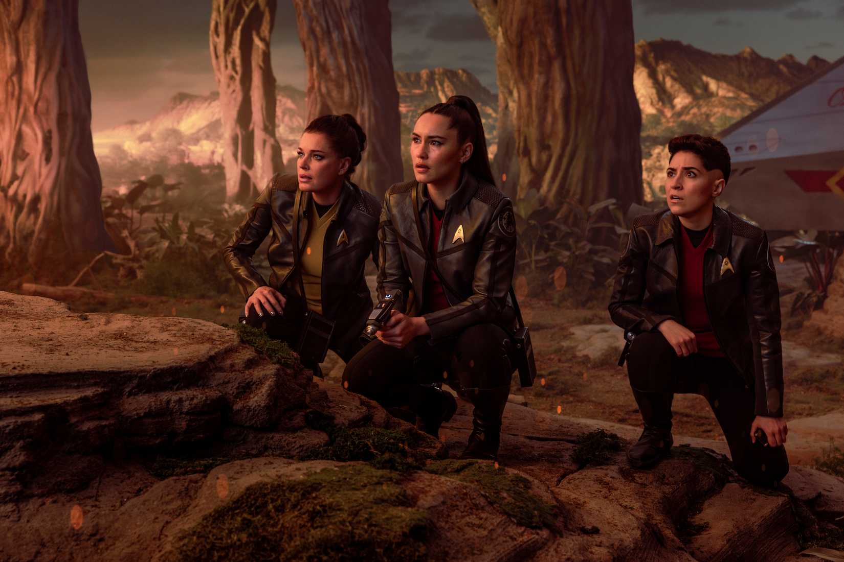 Rebecca Romijn as Una, Christina Chong as La’an Noonien-Singh, and Melissa Navia as Erica Ortegas in season 4, episode 1, of Star Trek: Strange New Worlds.