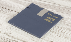 A Sony HiFD diskette lying on a wooden table.