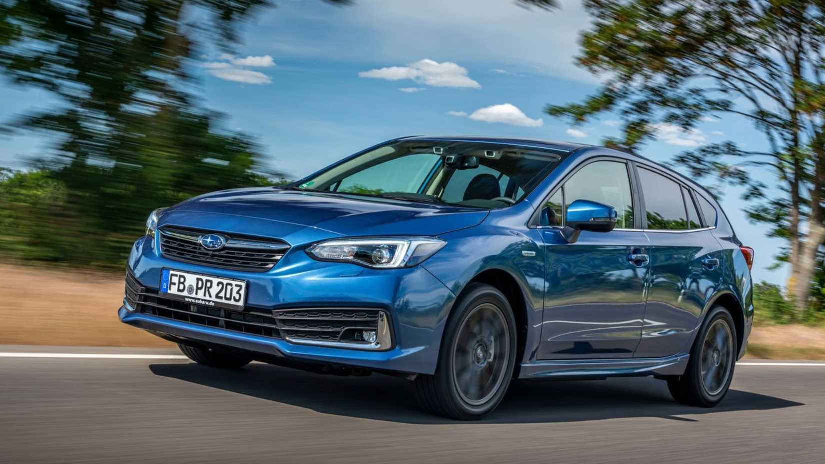 Dynamic front 3/4 shot of a blue 2020 Subaru Impreza.