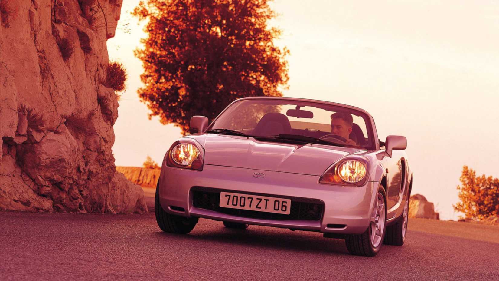 Dynamic front-end shot of a silver 2000 Toyota MR2.