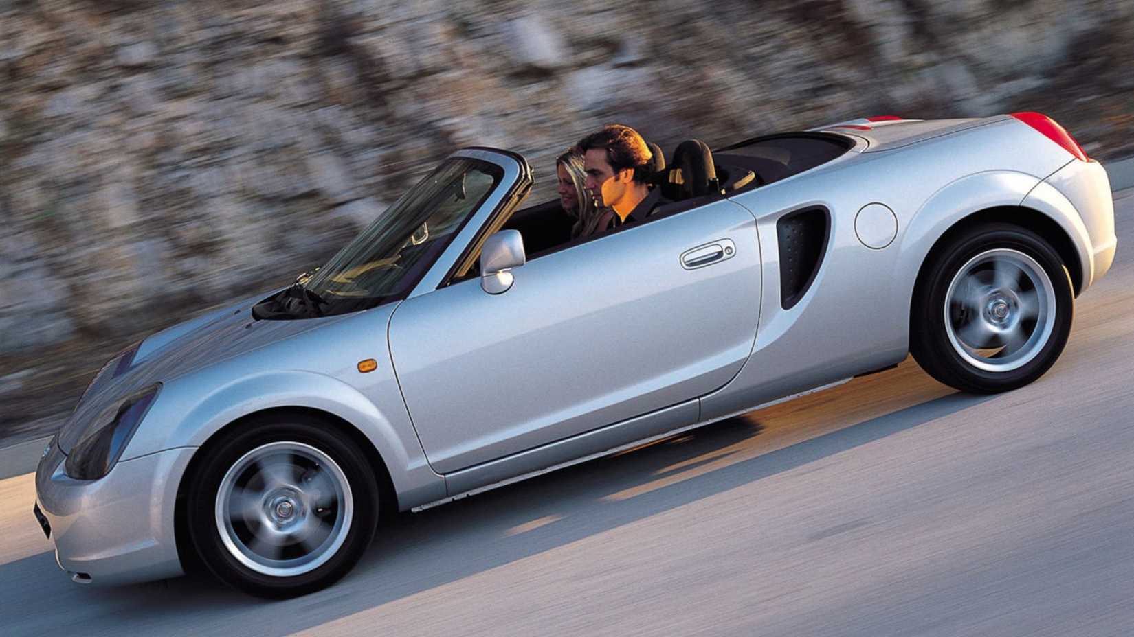 Dynamic side profile shot of a silver 2000 Toyota MR2.