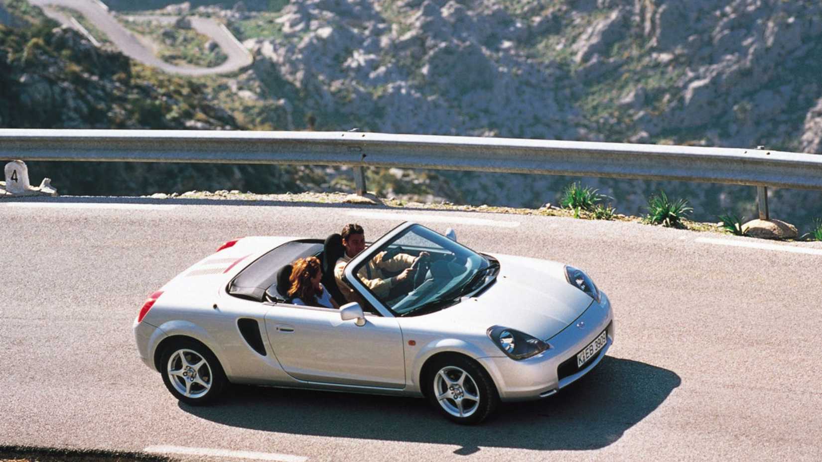 Dynamic side profile shot of a silver 2000 Toyota MR2.