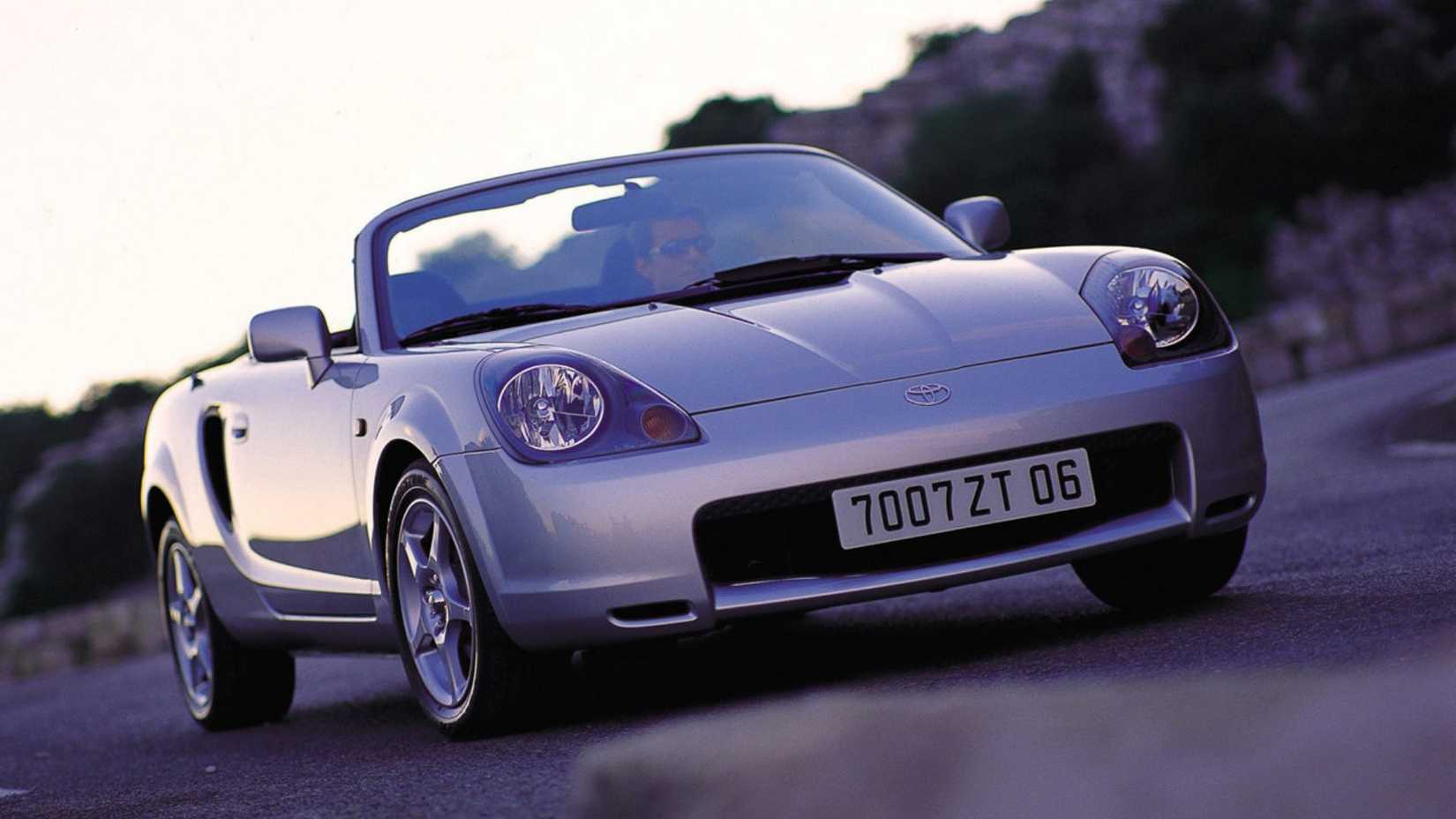 Dynamic front 3/4 shot of a silver 2000 Toyota MR2.