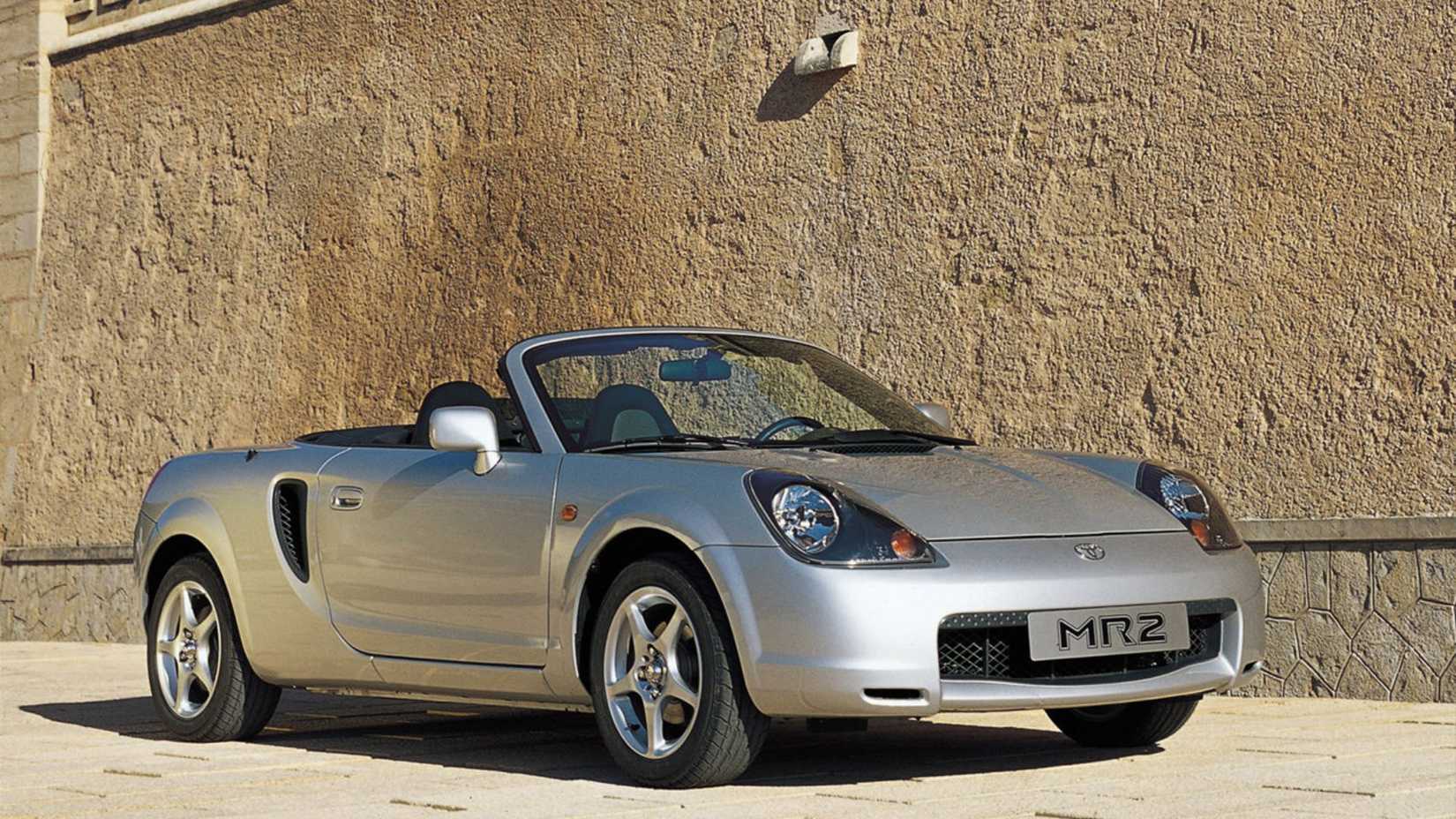 Static front 3/4 shot of a silver 2000 Toyota MR2.