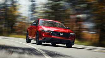 Front 3/4 action shot of a 2023 Honda Accord