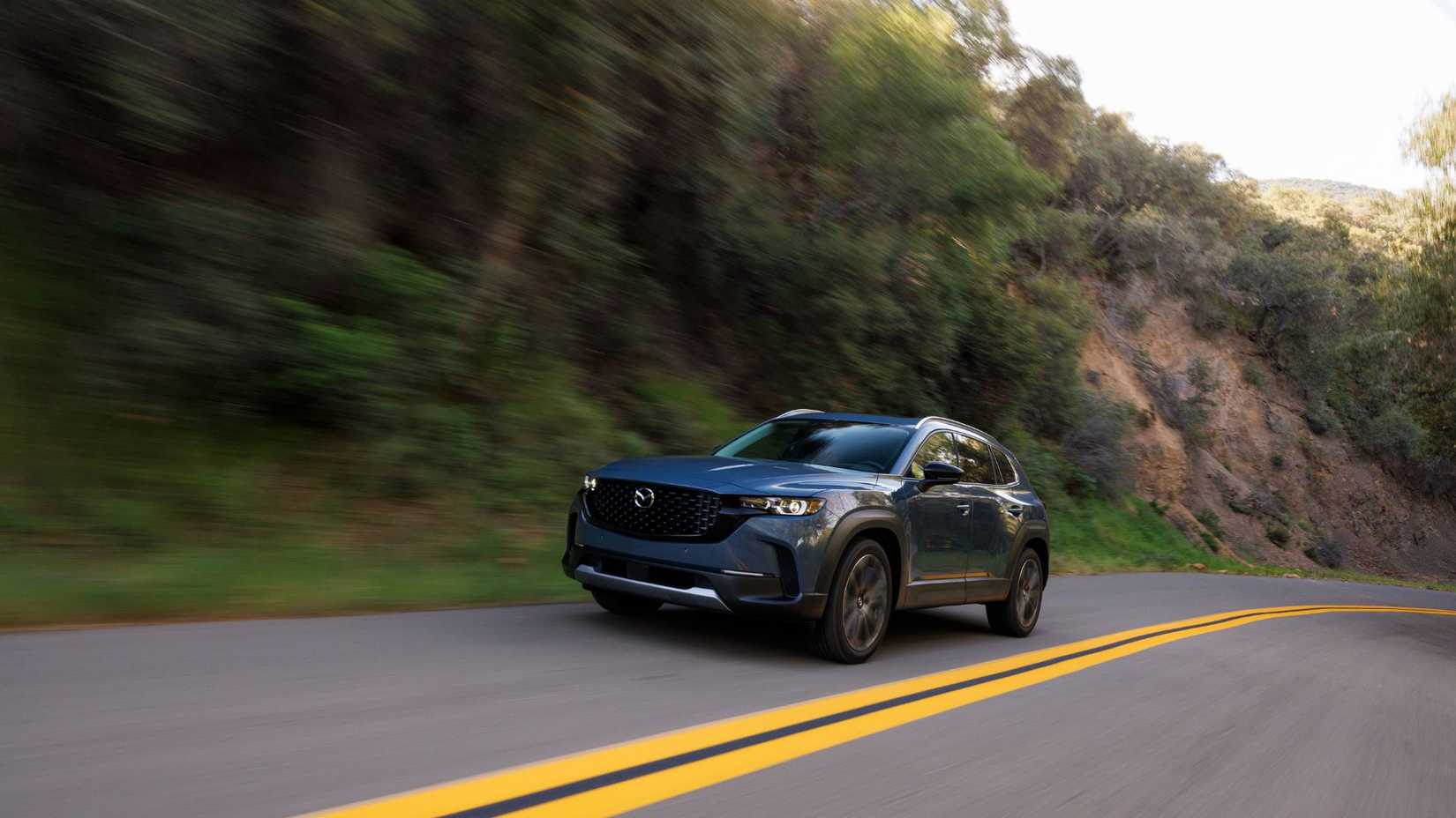 Dynamic front 3/4 shot of a 2026 Mazda CX-50.