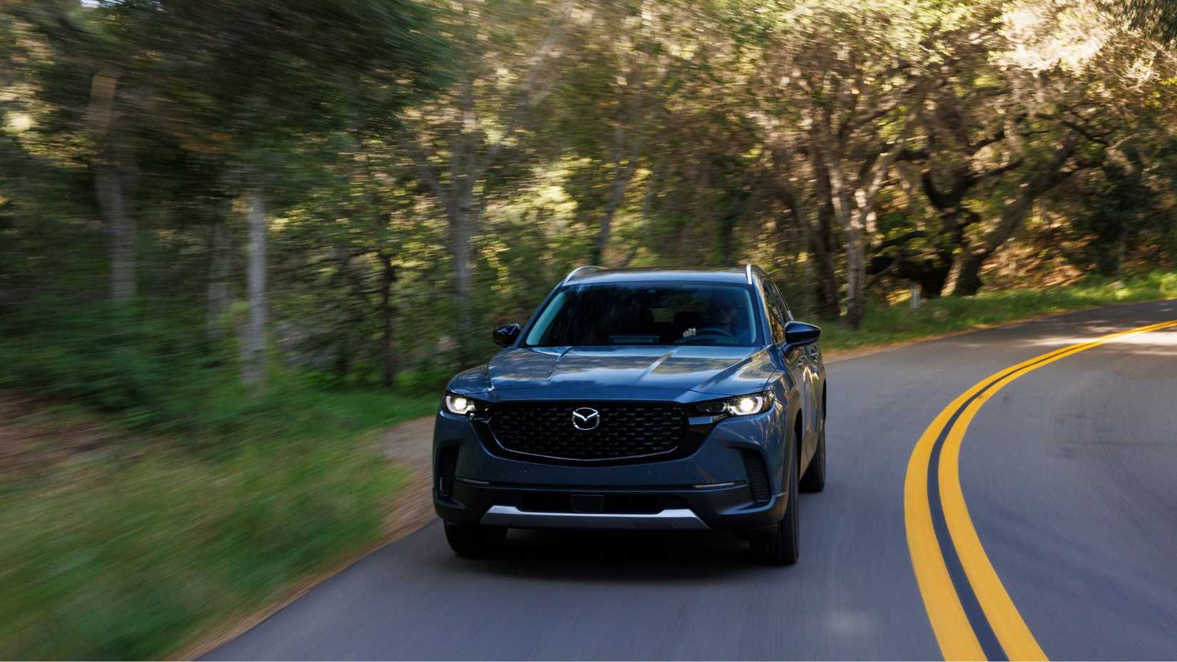 Dynamic front-end shot of a 2026 Mazda CX-50.
