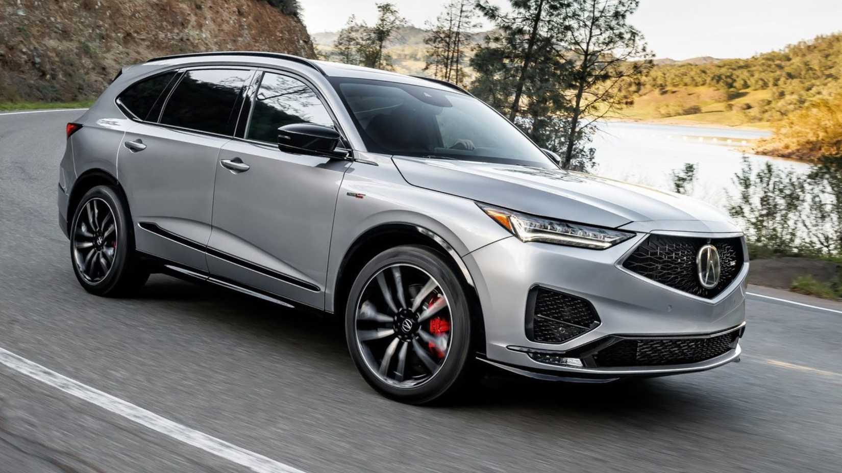 Dynamic side profile shot of a silver 2022 Acura MDX Type S.