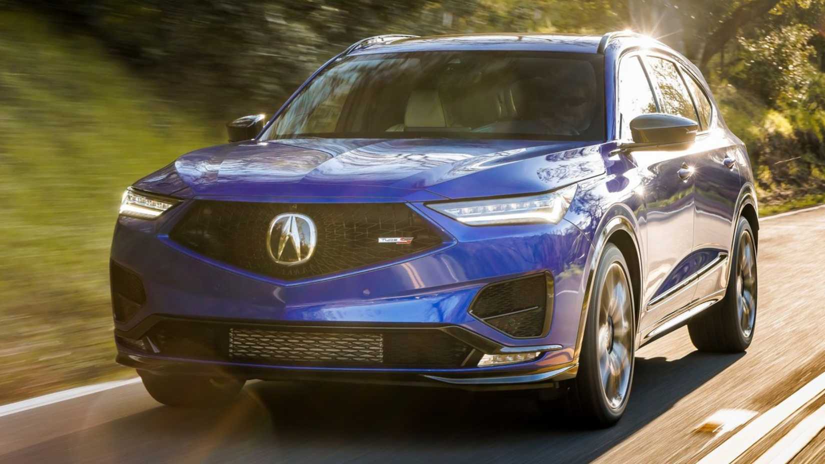 Dynamic front 3/4 image of the blue 2022 Acura MDX Type S.