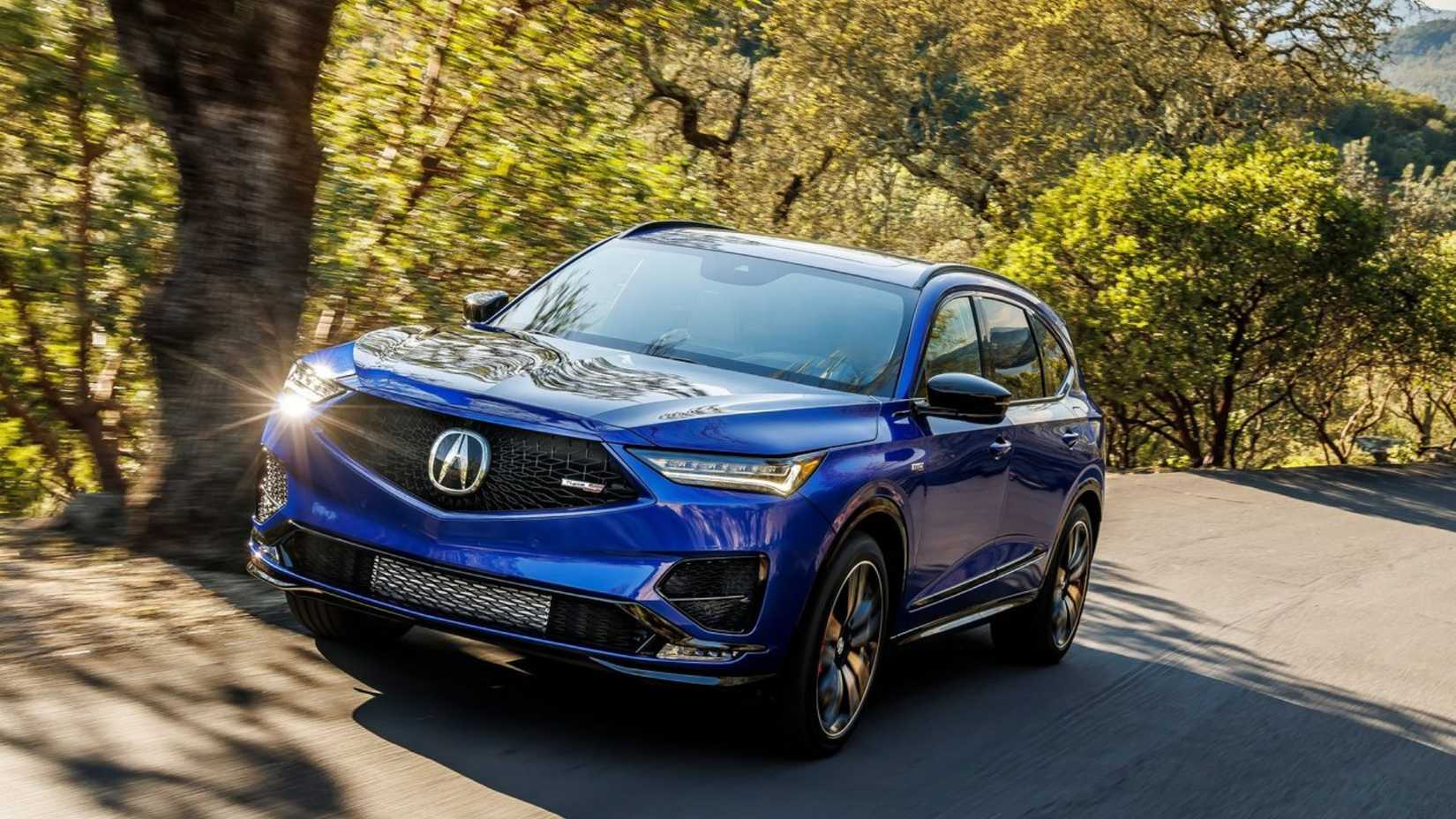 Dynamic front 3/4 image of the blue 2022 Acura MDX Type S.