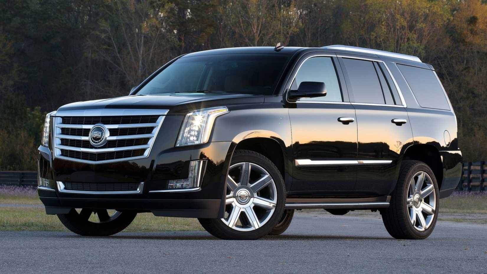 Static front 3/4 shot of a black 2015 Cadillac Escalade.