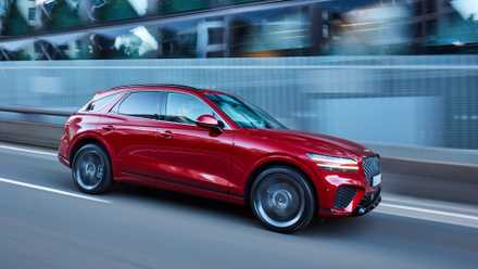 Front 3/4 action shot of a 2023 Genesis GV70