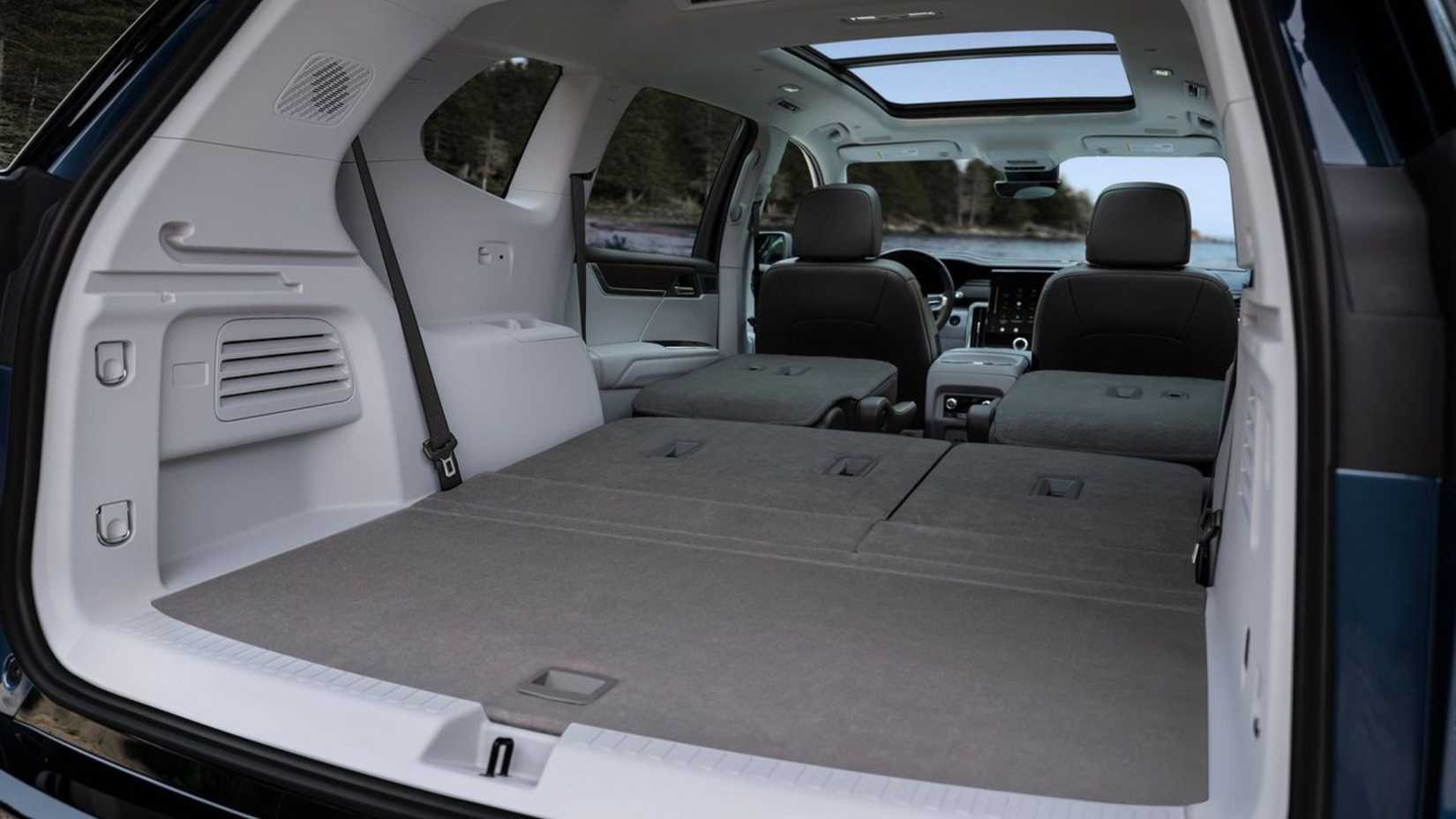 Shot inside the trunk of a 2024 GMC Acadia with both second and third-row seats folded.
