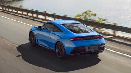 Rear 3/4 action shot of a 2026 Honda Prelude