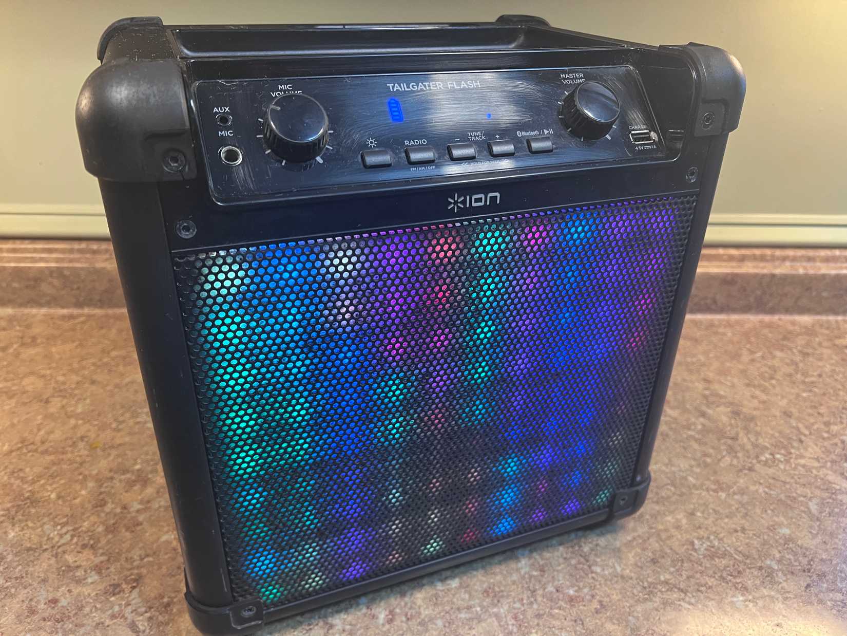 An image of an ION Tailgater Flash Bluetooth speaker turned on with the LEDs are lit on the front.