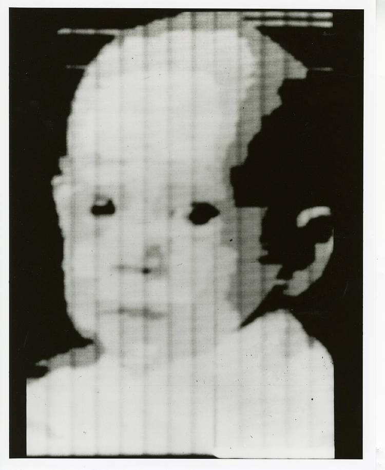 Grainy black-and-white scan of a child