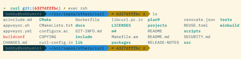 A terminal prompt with three sections of information, each on a block-colored background. 