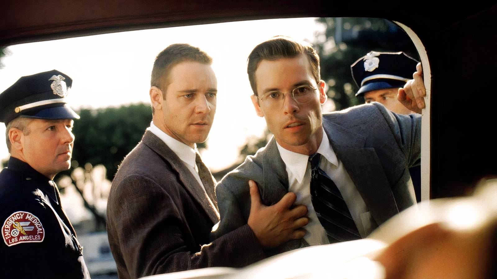 Russell Crowe holds Guy Pearce back in L.A. Confidential.