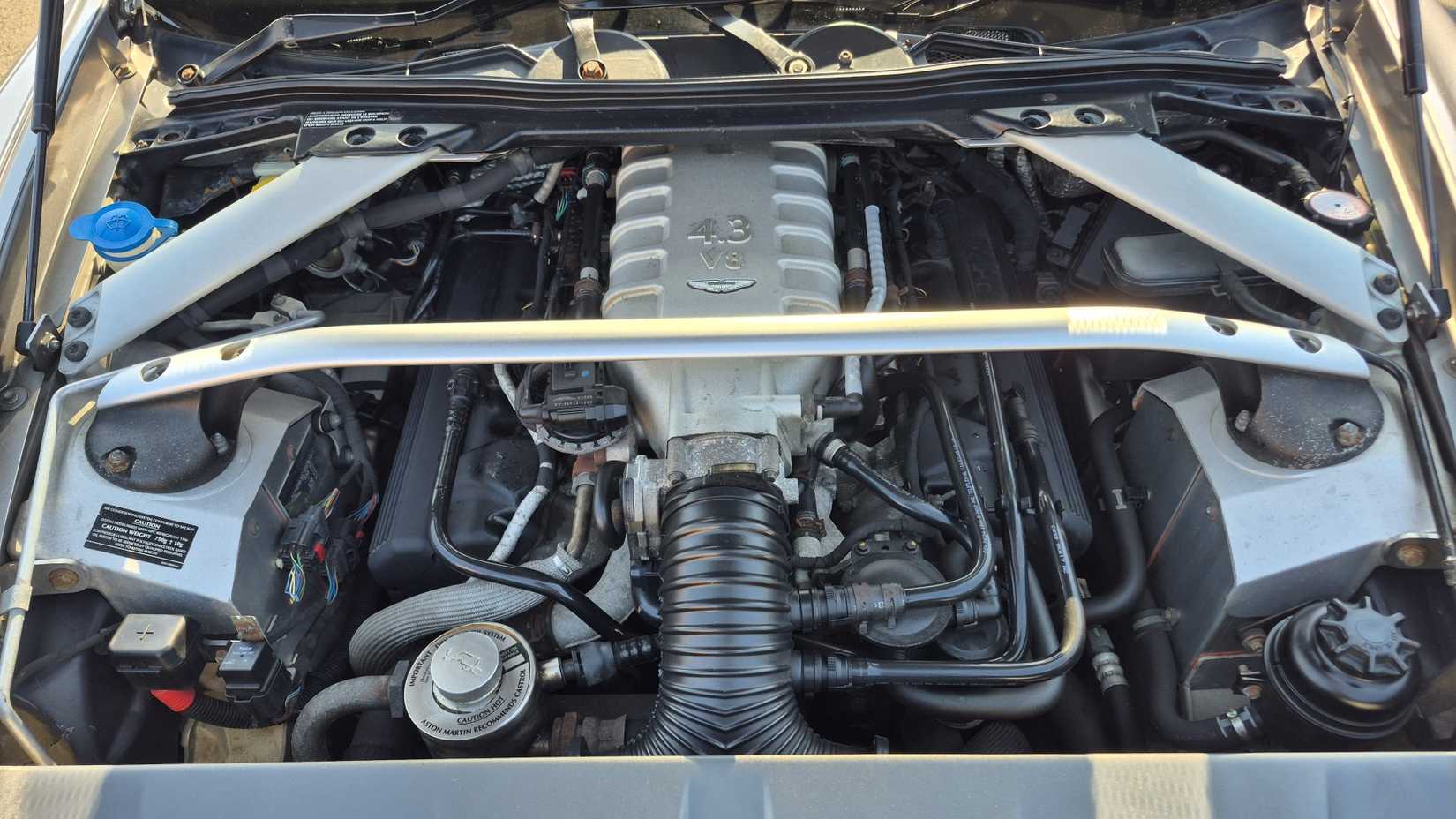 Close up of the engine bay in a 2006 Aston Martin V-8 Vantage