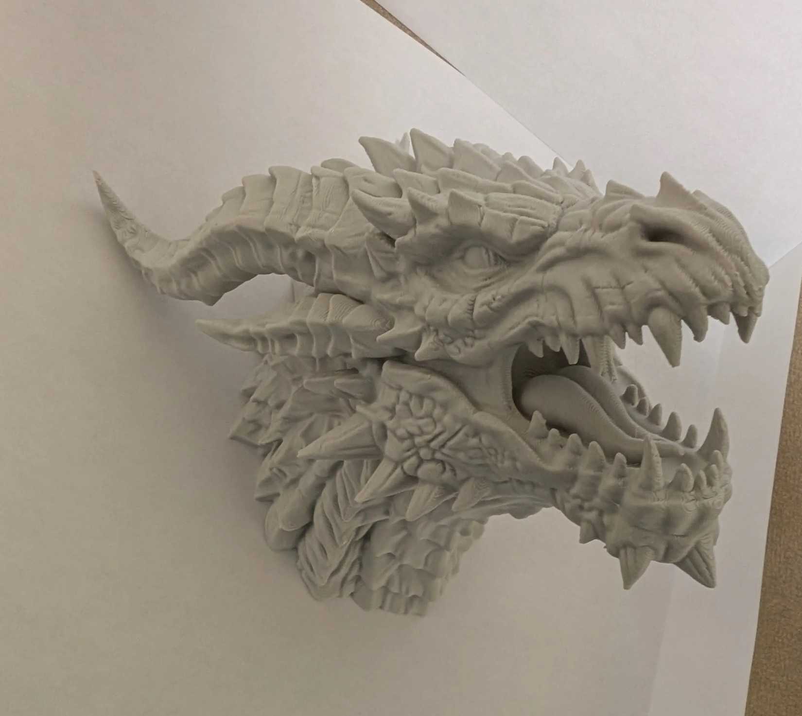 3D printed red dragon head on the wall by BK designs at MakerWorld.-1