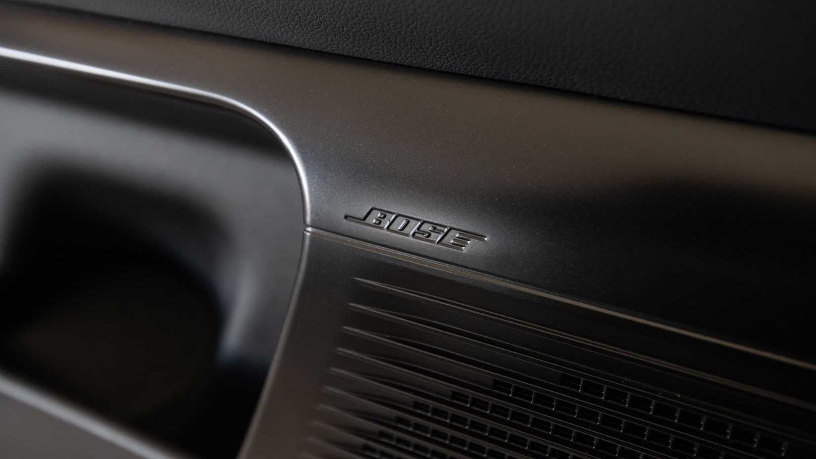 Close-up shot of the Bose speaker in a 2027 Hyundai Iomniq 9 Calligraphy Black Ink.