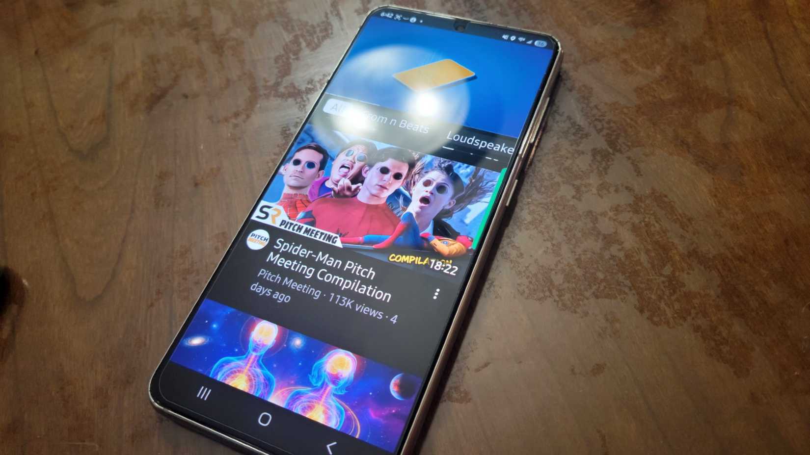 A phone playing a video to get water out