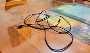 A USB C cord on a table