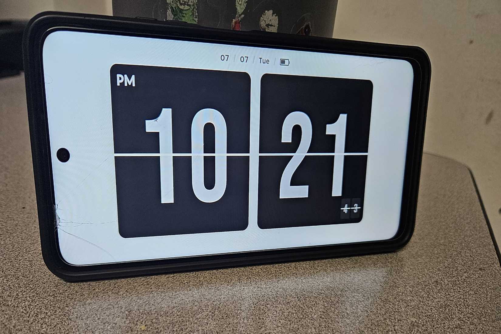 Vintage style flip clock screen on updated android phone.