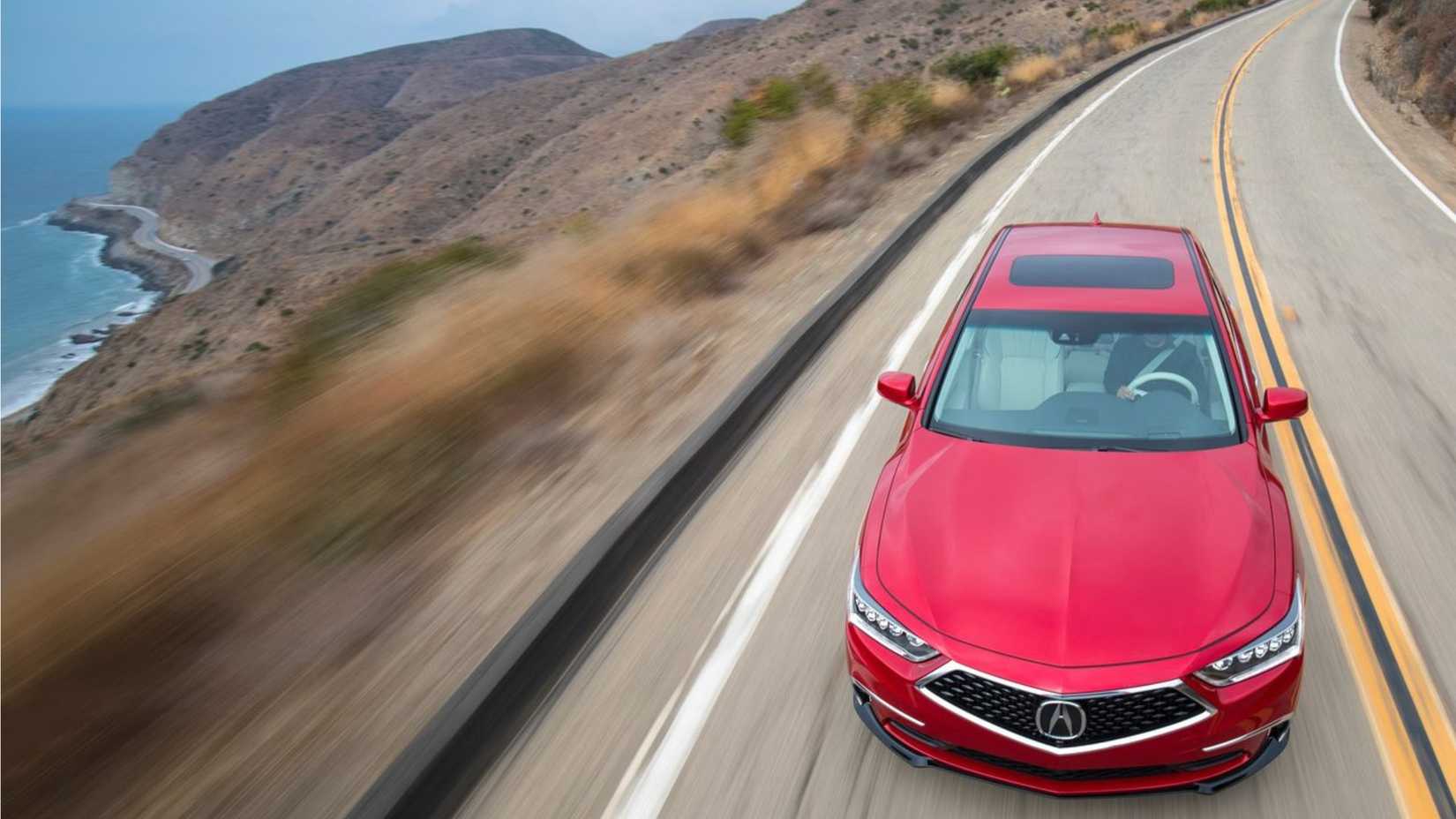 Dynamic overhead front-end shot of a red 2018 Acura RLX.