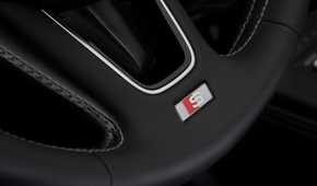 Close-up shot of the detailing on the steering wheel of a 2017 Audi S4.