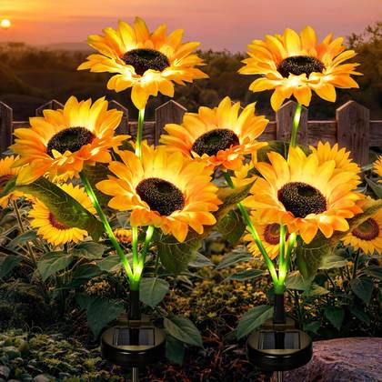 GIGALUMI solar sunflower lights in a garden bed
