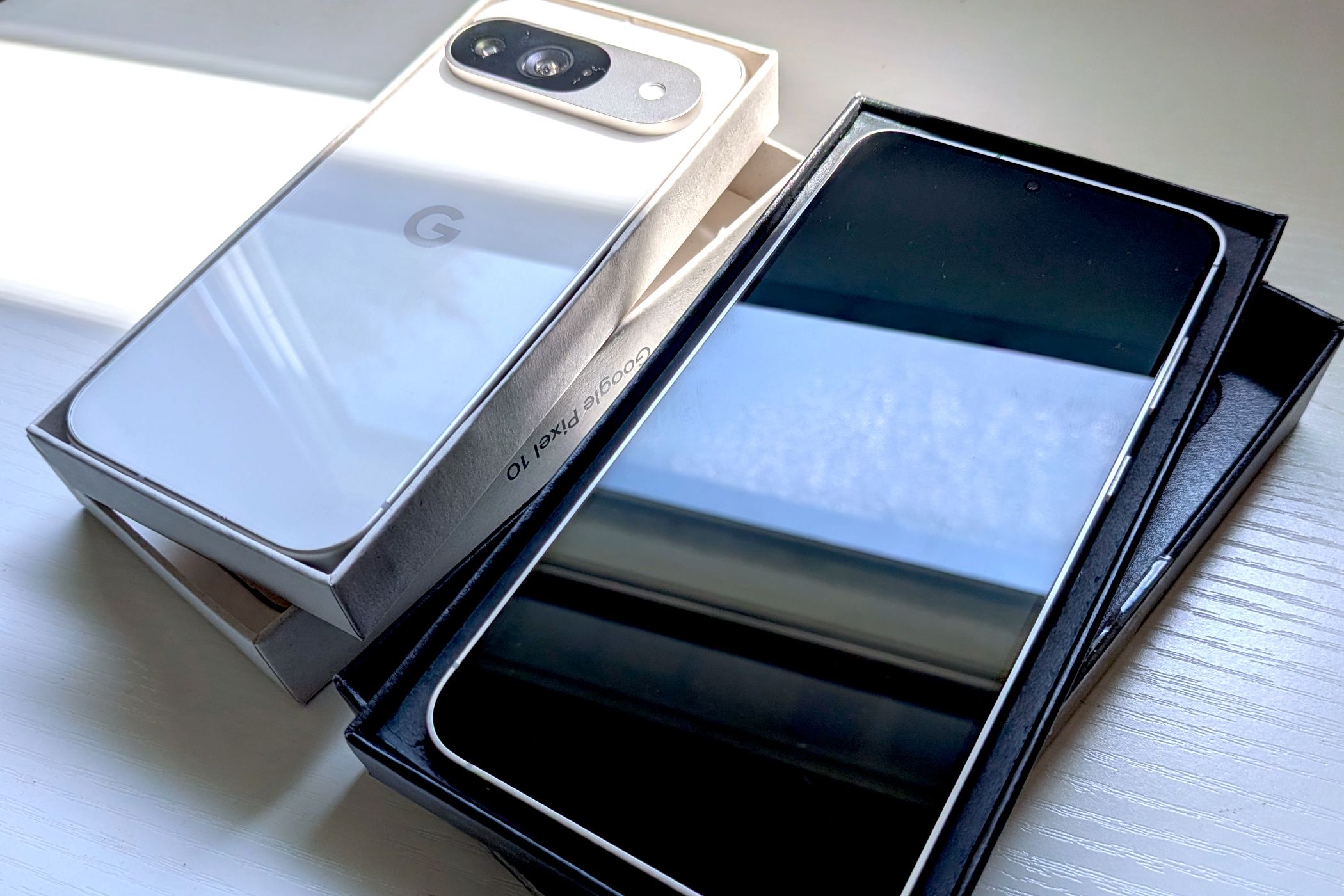 Google Pixel and Samsung Galaxy with packaging box