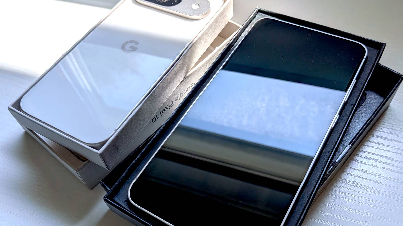Google Pixel and Samsung Galaxy with packaging box