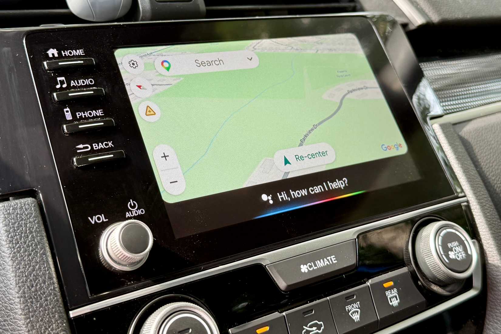 Google Maps app open on Android Auto with Google Assistant enabled.