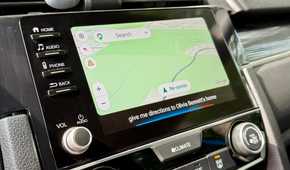 Google Maps app open on Android Auto with Google Assistant enabled.