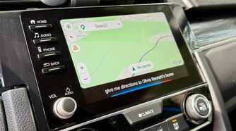 Google Maps app open on Android Auto with Google Assistant enabled.