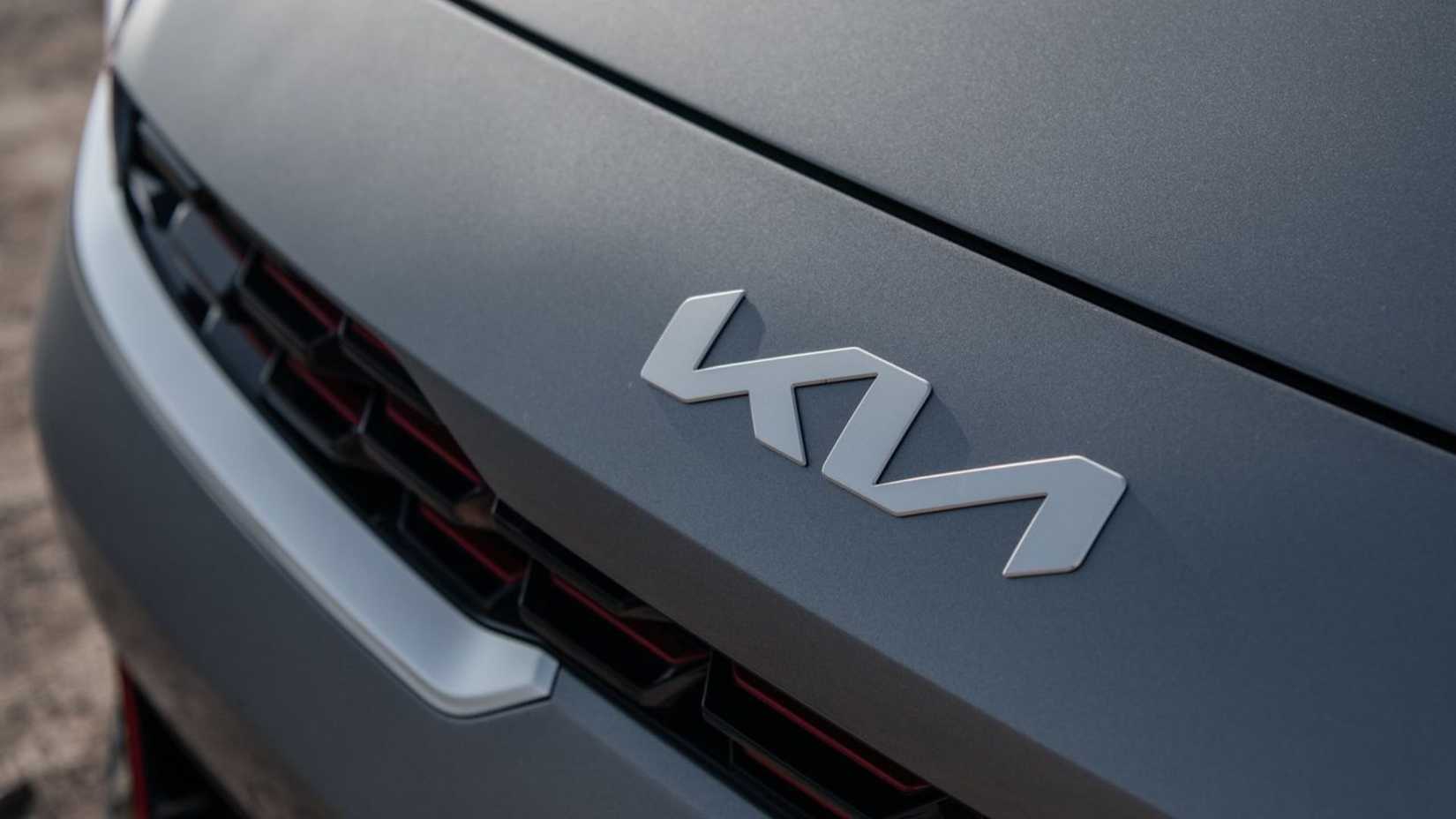 Close-up shot of the badge on the hood of a 2022 Kia Forte.