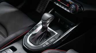 Close-up shot of the gear shifter in a 2022 Kia Forte.