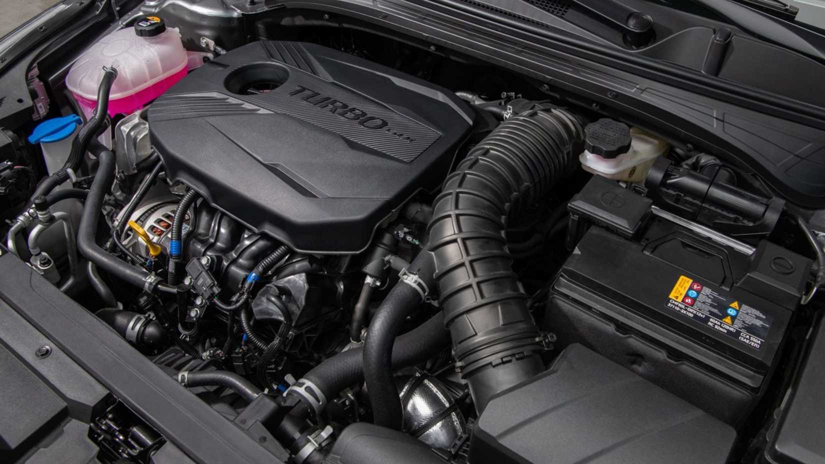 Shot of the engine under the hood of a 2022 Kia Forte.